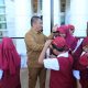 Bupati Irwan Ajak Ayah Luangkan Waktu untuk Anak, Mulai dari Mengambil Rapor hingga Mengantar ke Sekolah